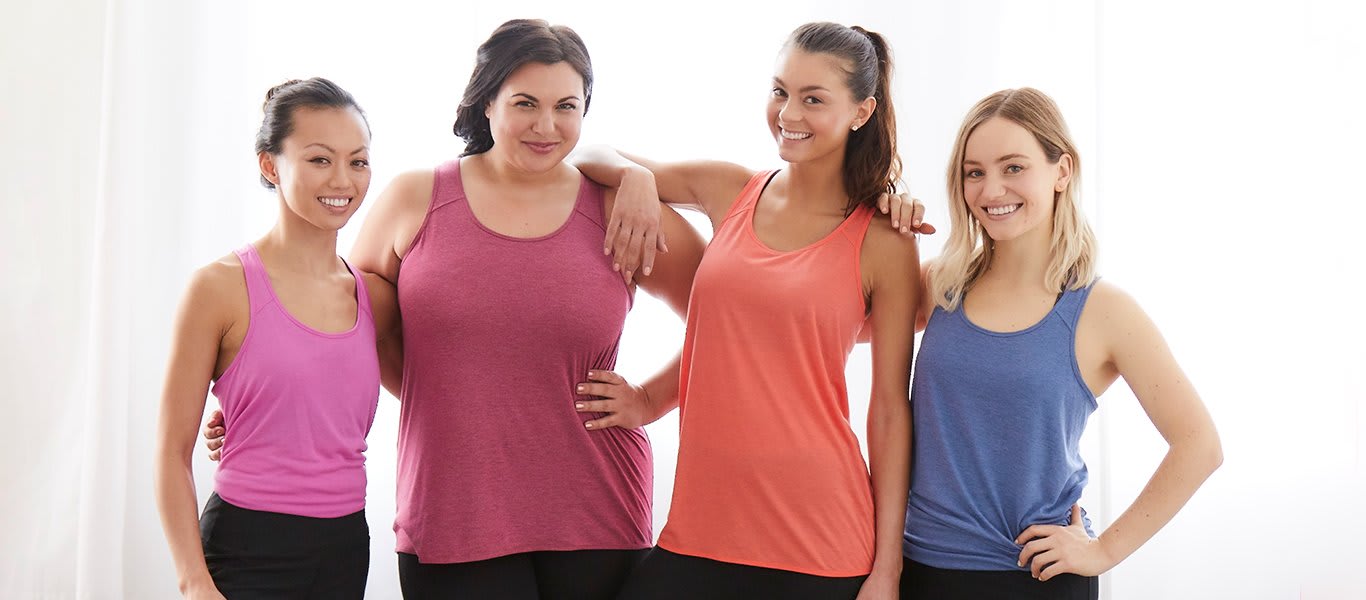 Four women wearing RBX tank tops
